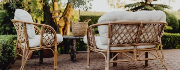rattan furniture in the garden at sunset