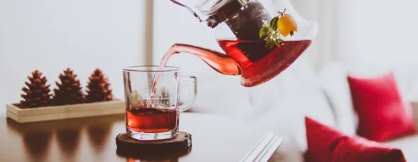 pouring roibos tea