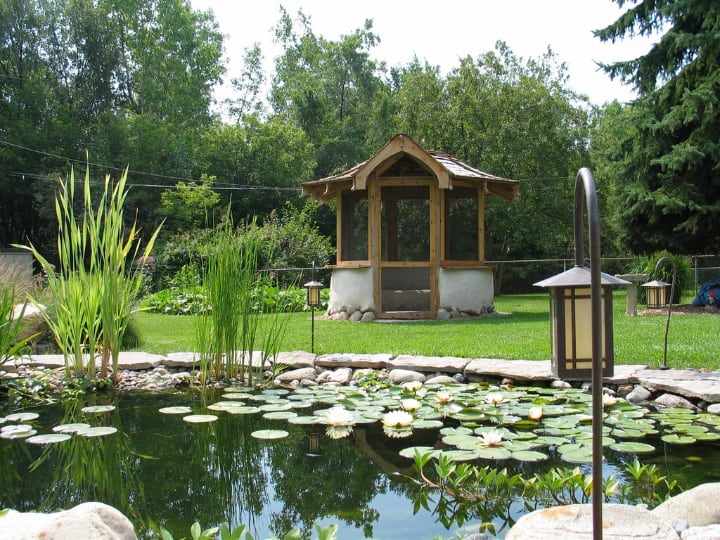 gazebo near an artificial lake