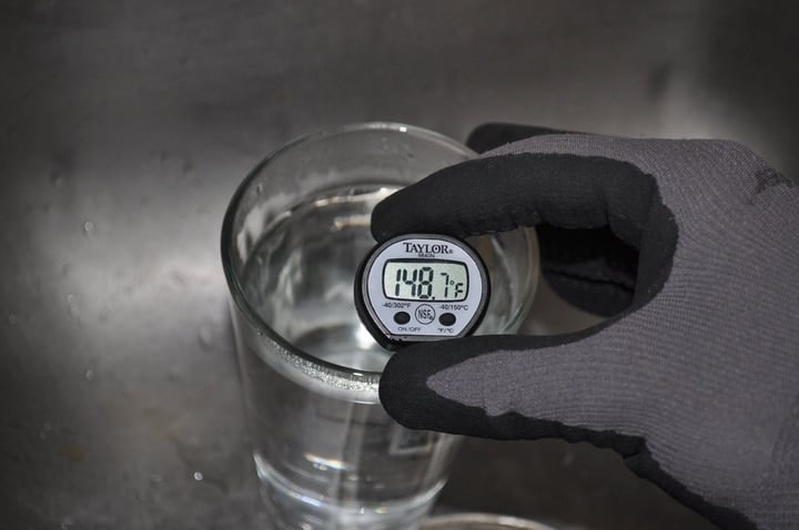 measuring water temperature on a kitchen thermometer