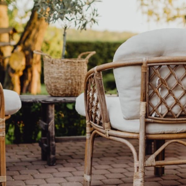 rattan furniture in the garden at sunset