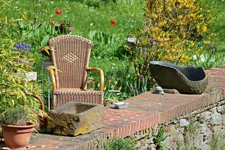 rattan garden chair with plants