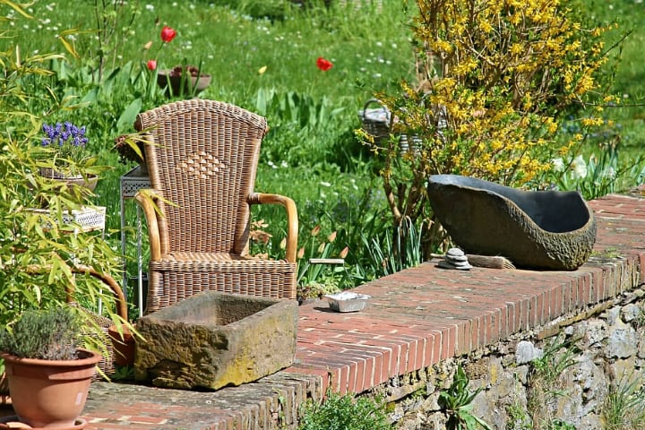 rattan garden chair with plants