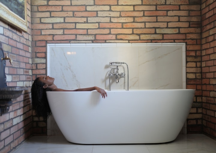 woman gaving a long relaxing bath