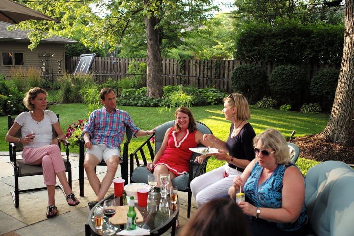 chilling and drinking on the garden furniture outdoors with family