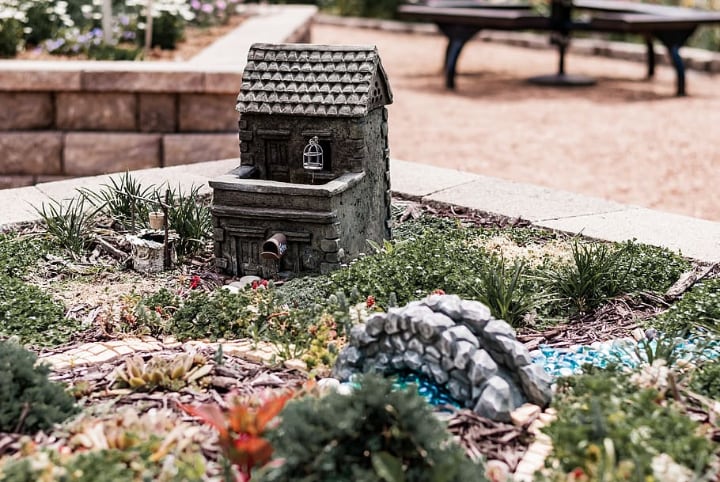 fairy garden with miniature house ad decorations