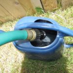 disposing rain water using a watering can