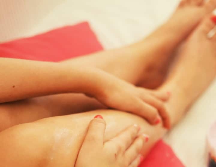 rubbing bergamot oil on feet and thighs