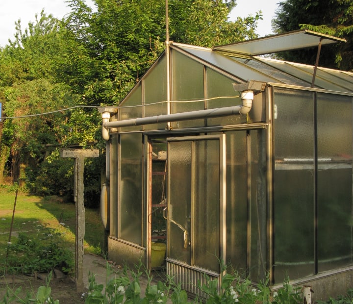 greenhouse with open vent and door