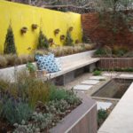 garden design with landscaping rocks greens and water feature