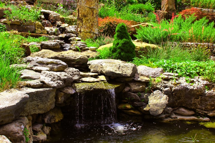 decorative garden rocks on pond