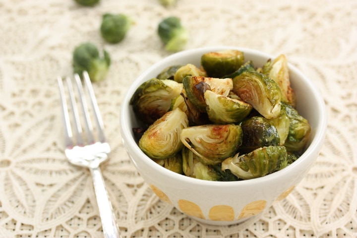 eating brussel sprouts with fork