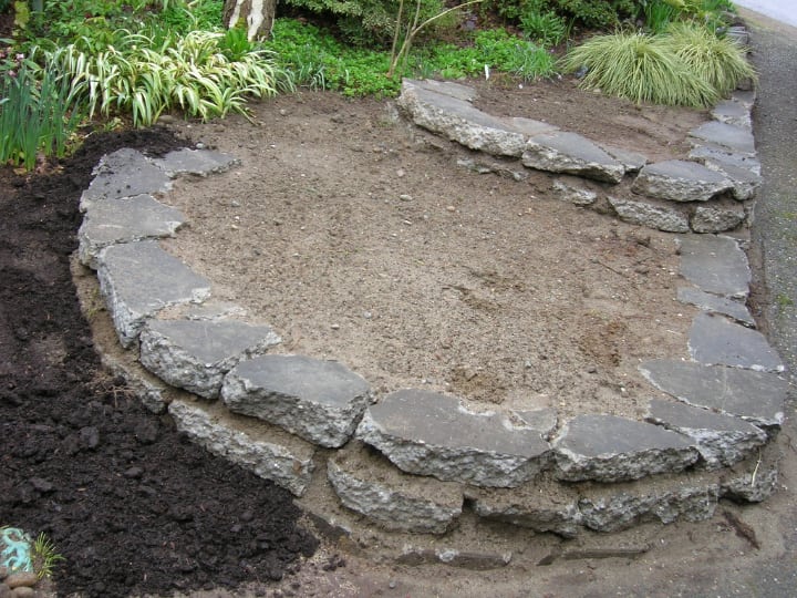 layering rock garden with soil