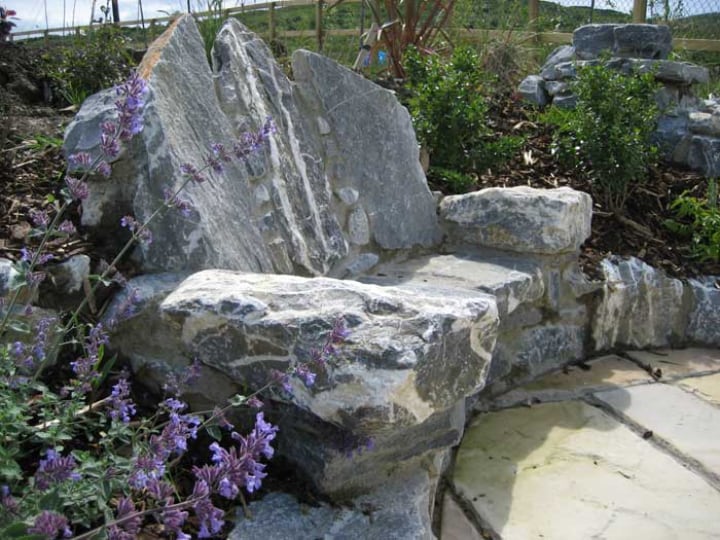 limestone seat on the rock garden