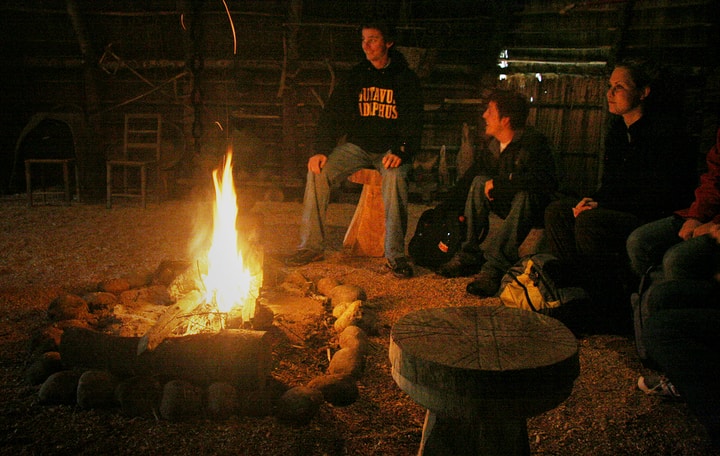 gathering in a firepit at night