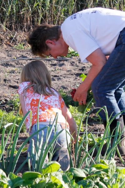 man and child gardening together
