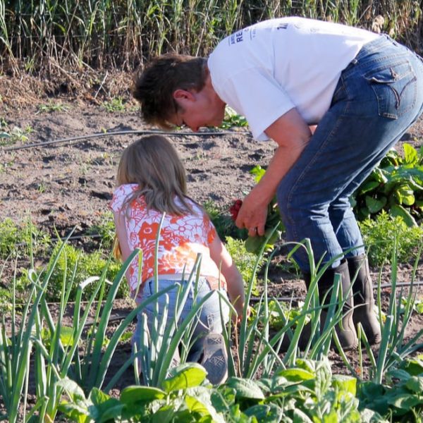man and child gardening together