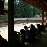 people spending time on a zen garden